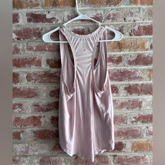 Lululemon baby pink racer back top. Size 8. Small stains pictured. - Picture 2 of 5